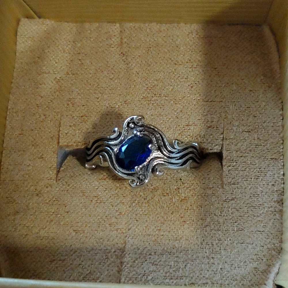 Silver . 925 ring size 8.dark blue stone (not real